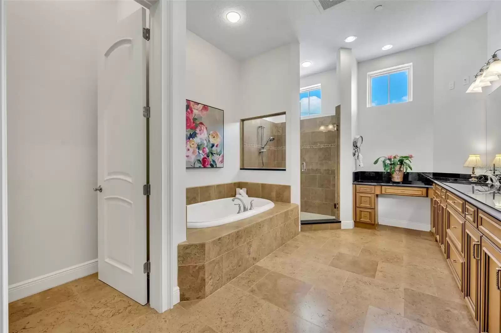 Primary bathroom- large shower stall, garden tub, & water closet