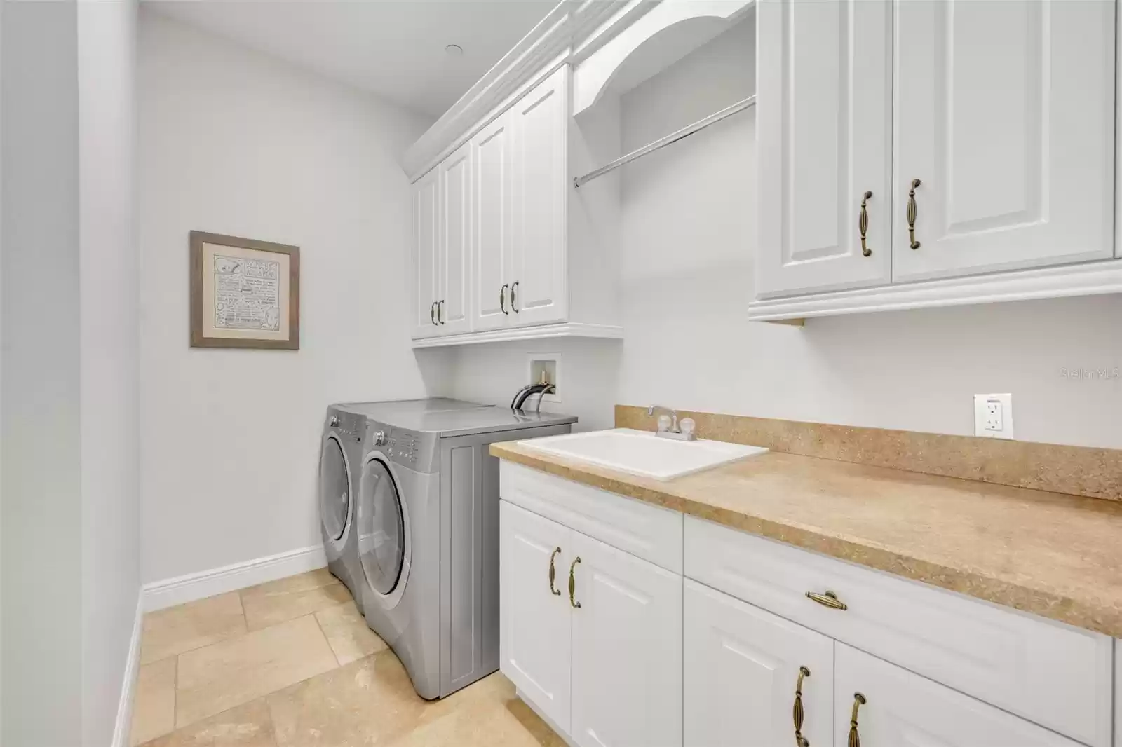 2nd floor laundry room with a sink & tons of storage