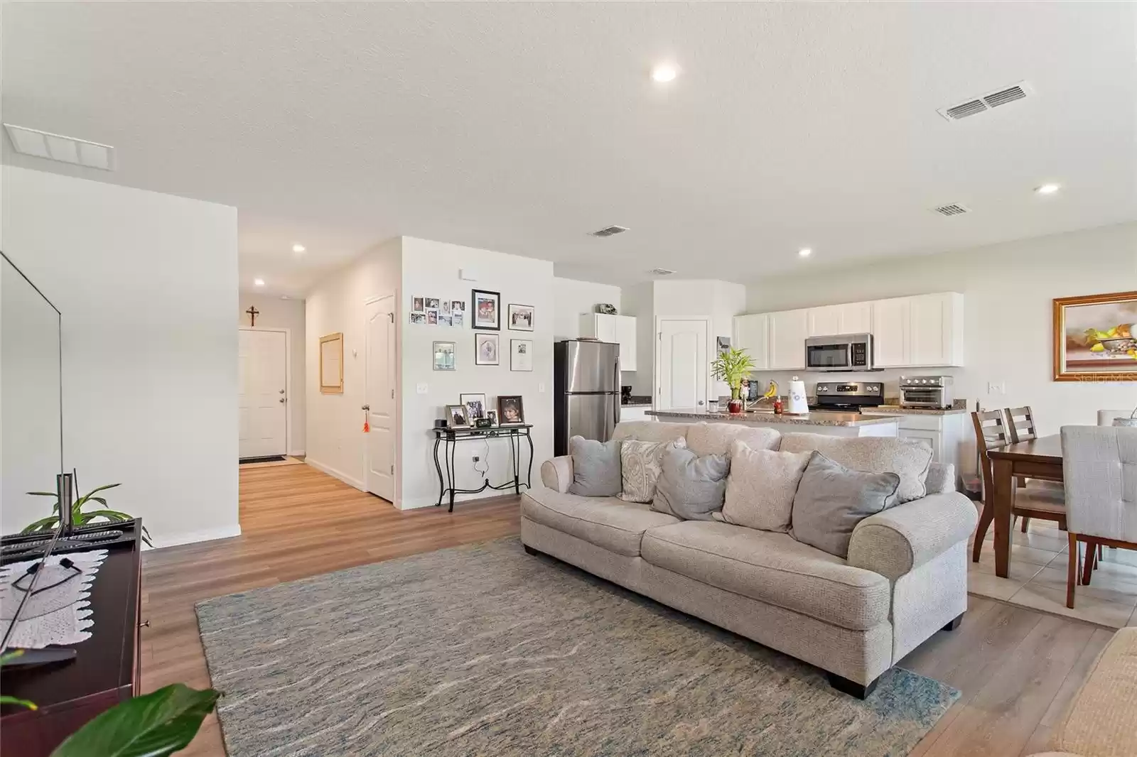 View of Living room to Entrance and Kitchen