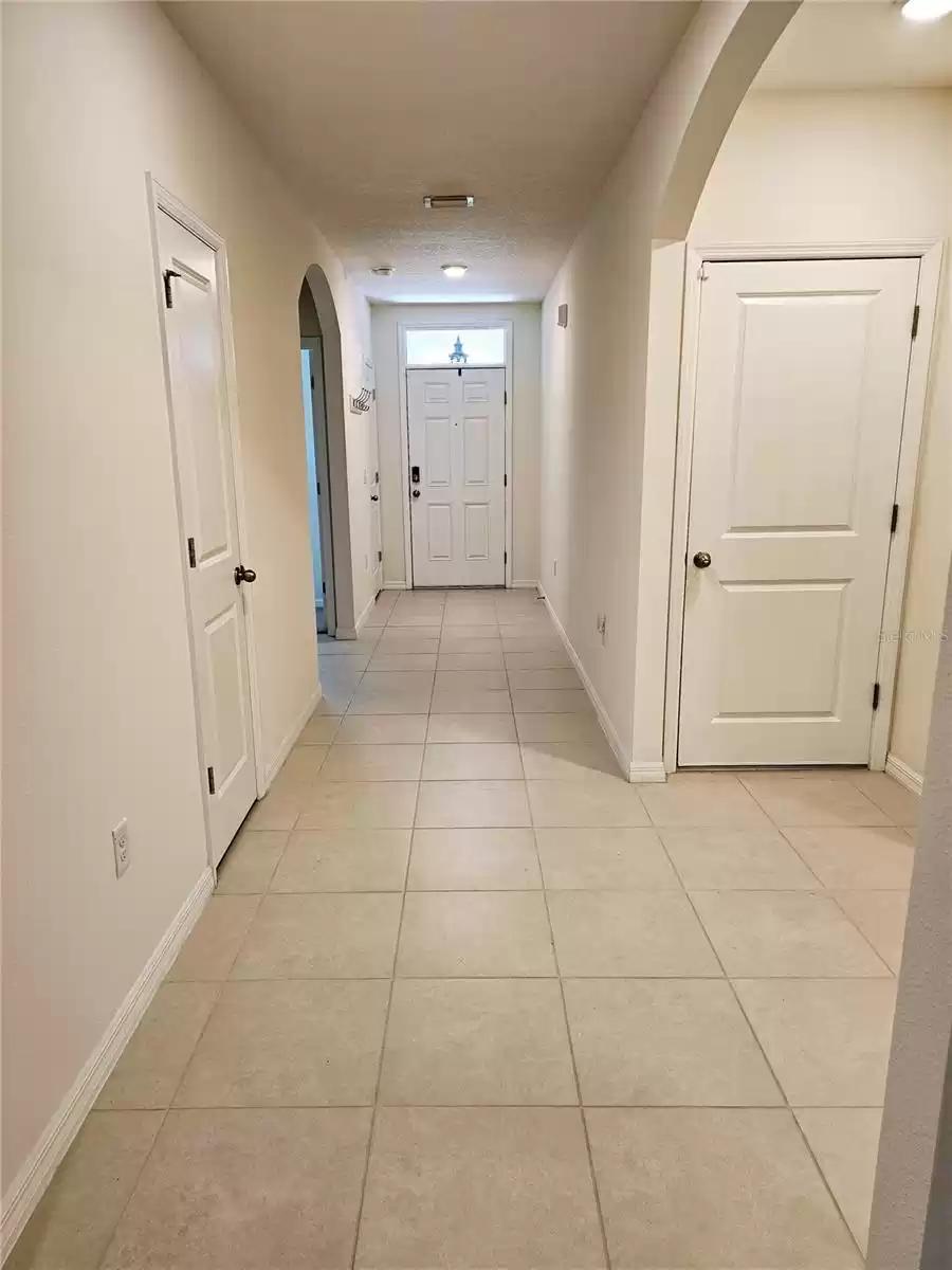 Hallway to front door, garage, laundry and 3 bedrooms