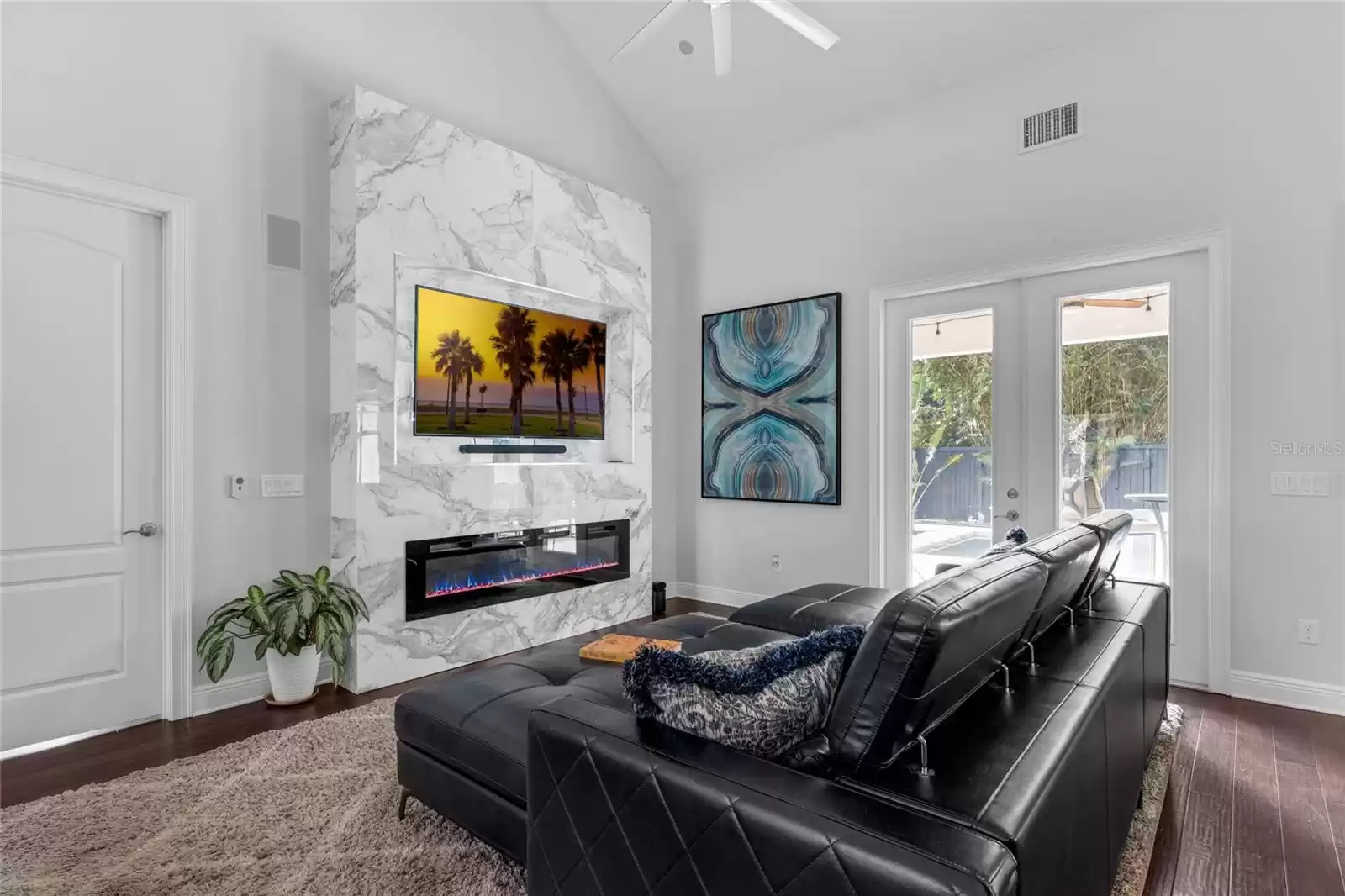 Living area with vaulted ceilings.