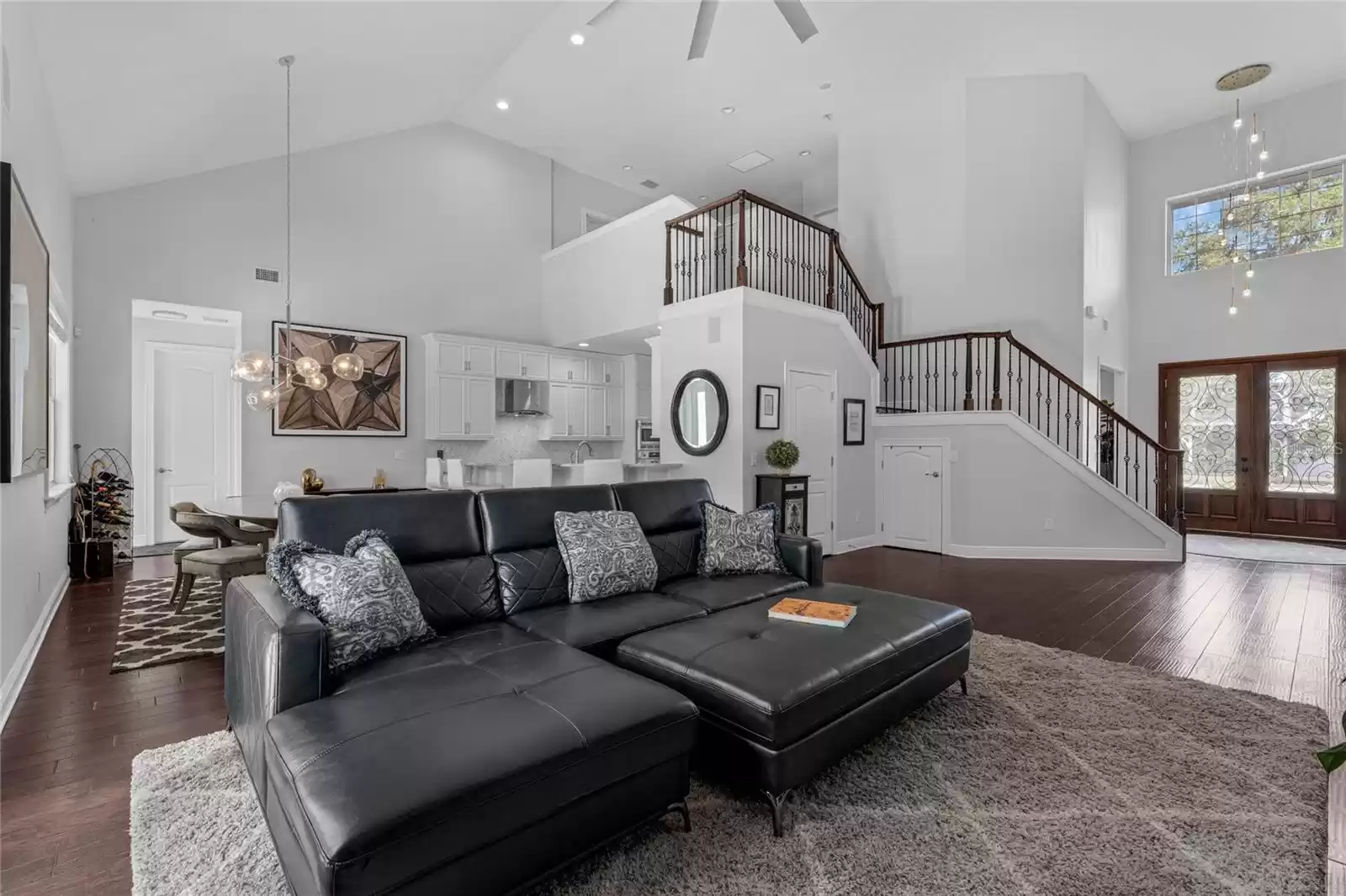 Living area with vaulted ceilings, open floor plan.