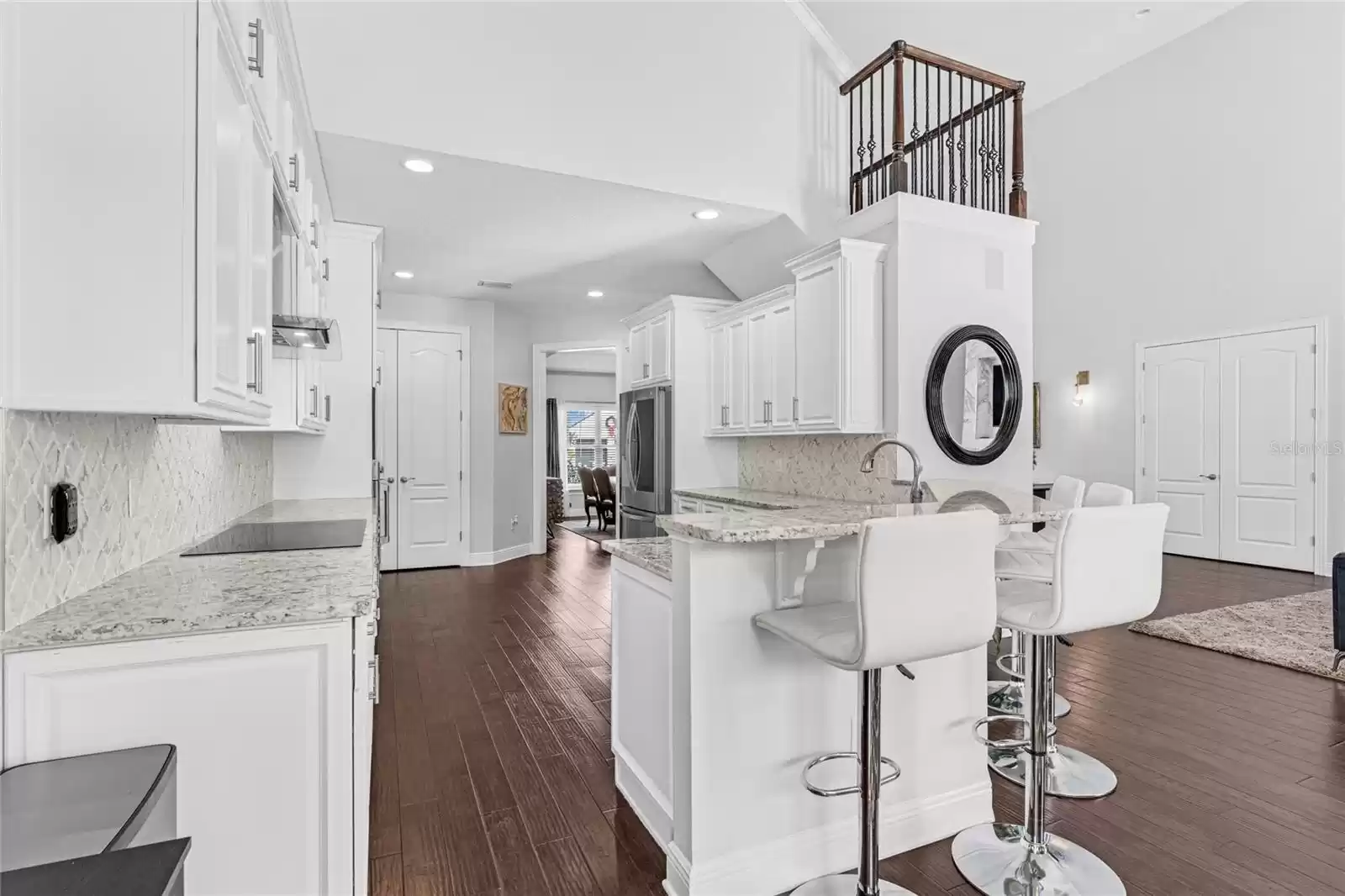 Kitchen and breakfast bar open to the living area.