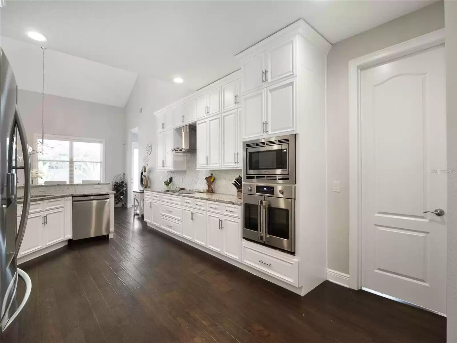 Kitchen looking toward the dinette and breakfast bar.