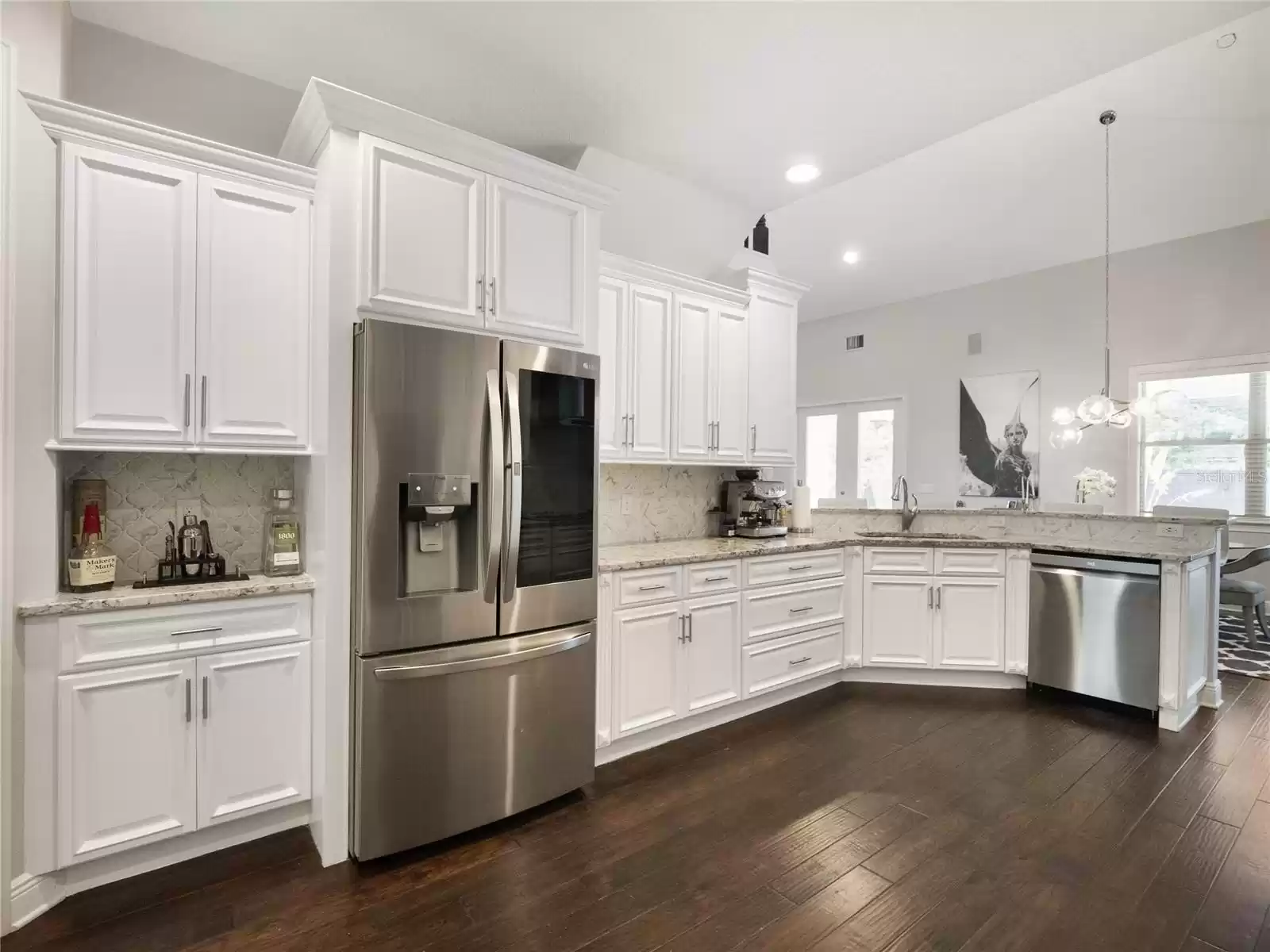 Kitchen looking toward the dinette and breakfast bar.