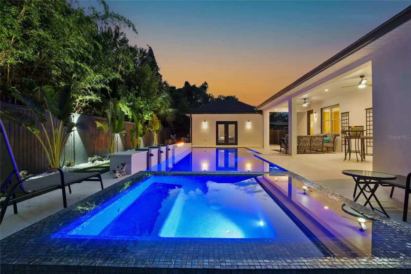 Pool and back porch at twilight.