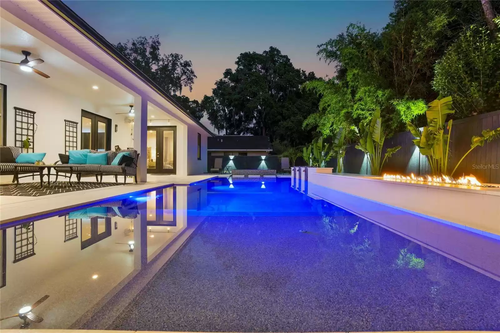 Pool and back porch at twilight.