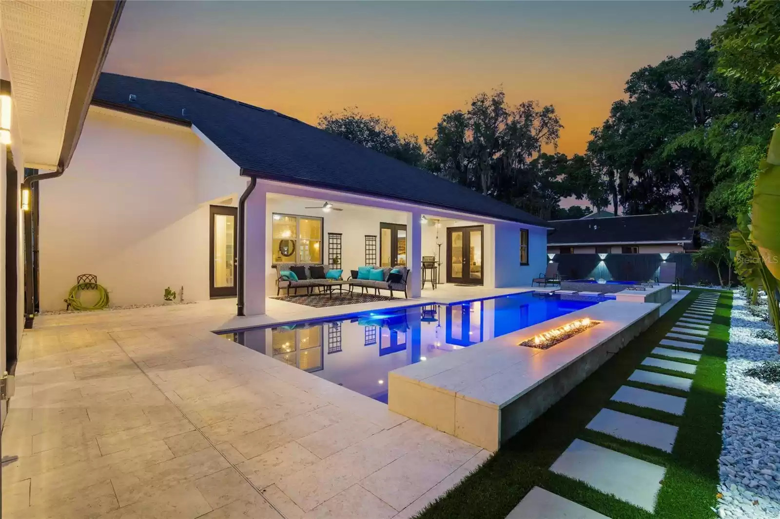 Pool and back porch at twilight.