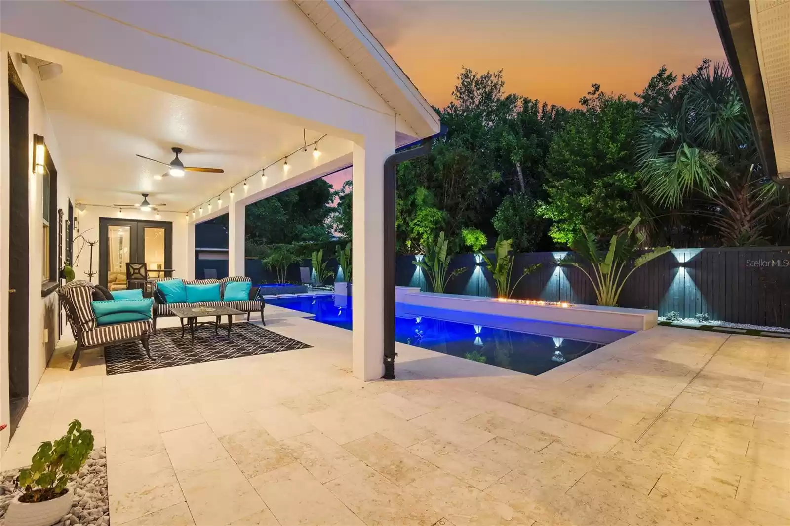 Pool and back porch at twilight.