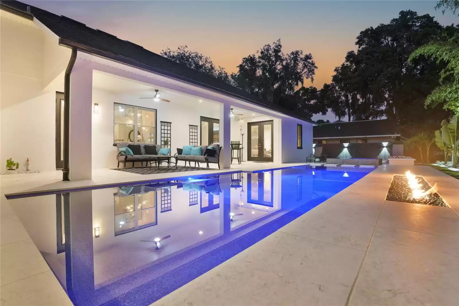 Pool and back porch at twilight.