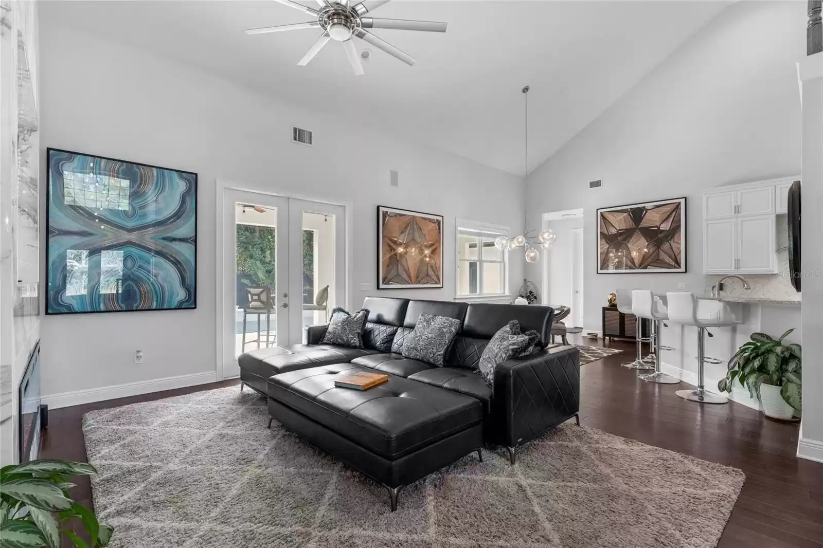 Living area with vaulted ceilings, open floor plan.