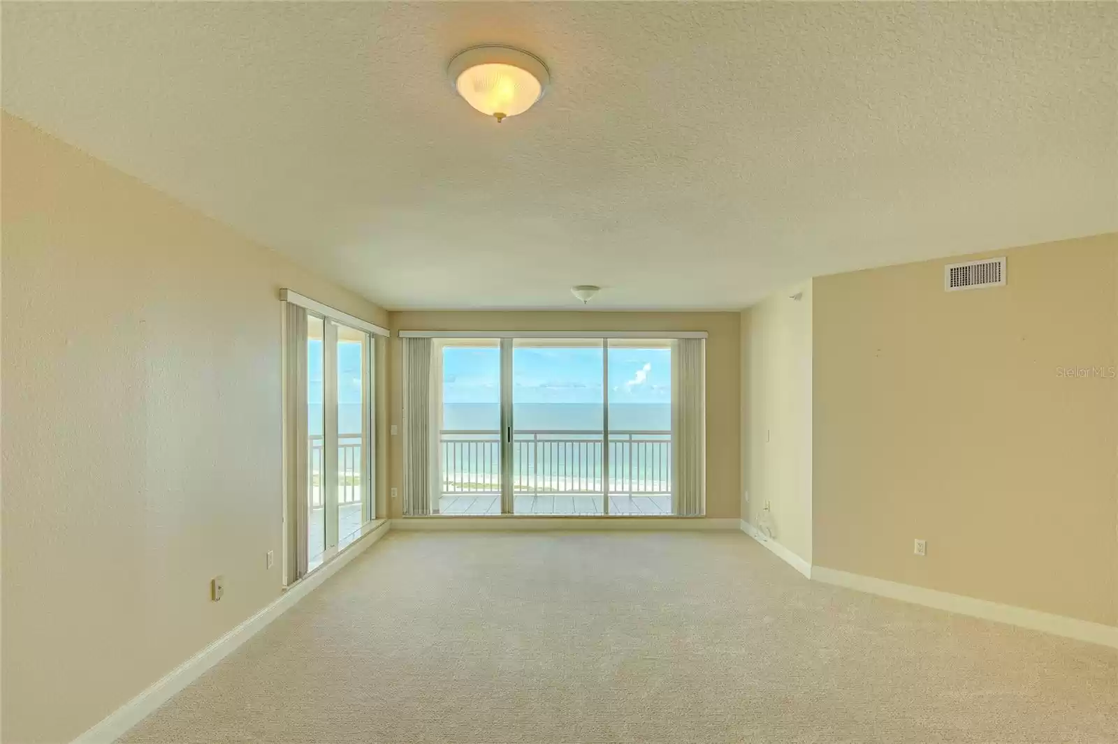 From the dining area toward the living area.  AMAZING views of the beach, pools and grounds of the Grande.