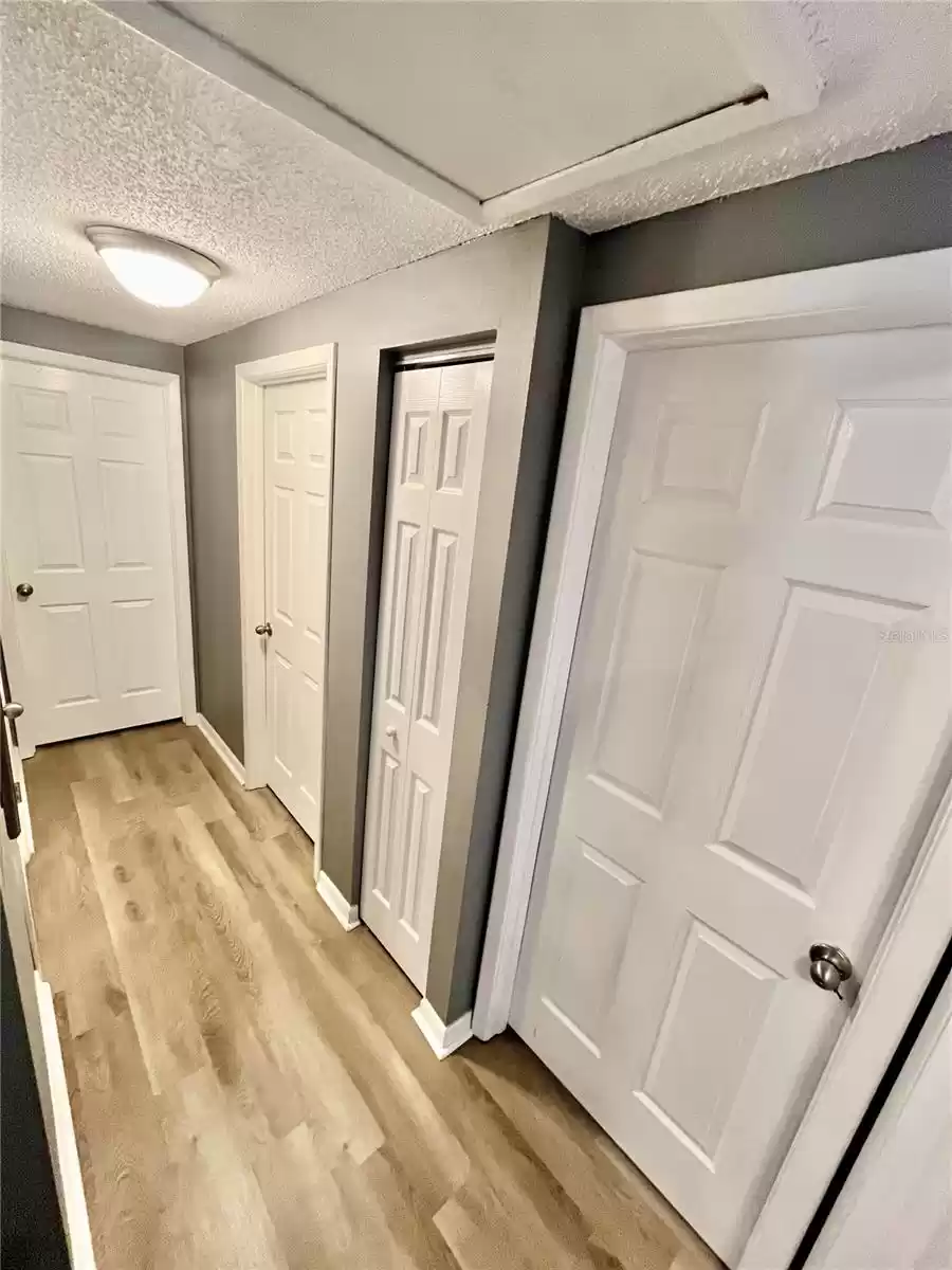 Hallway to bedrooms & linen closet