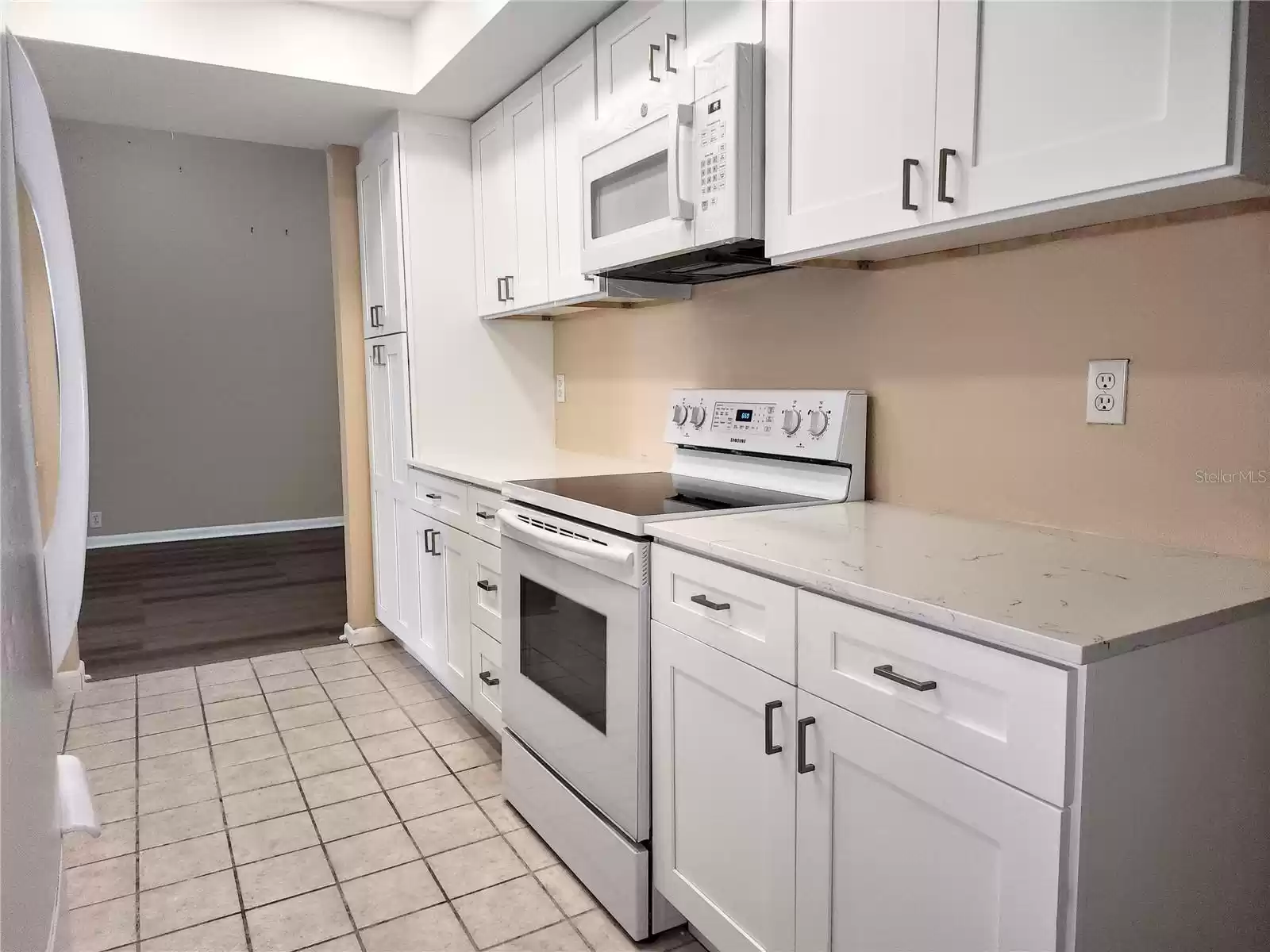 Kitchen With New Quartz Countertop & Shaker Cabinets