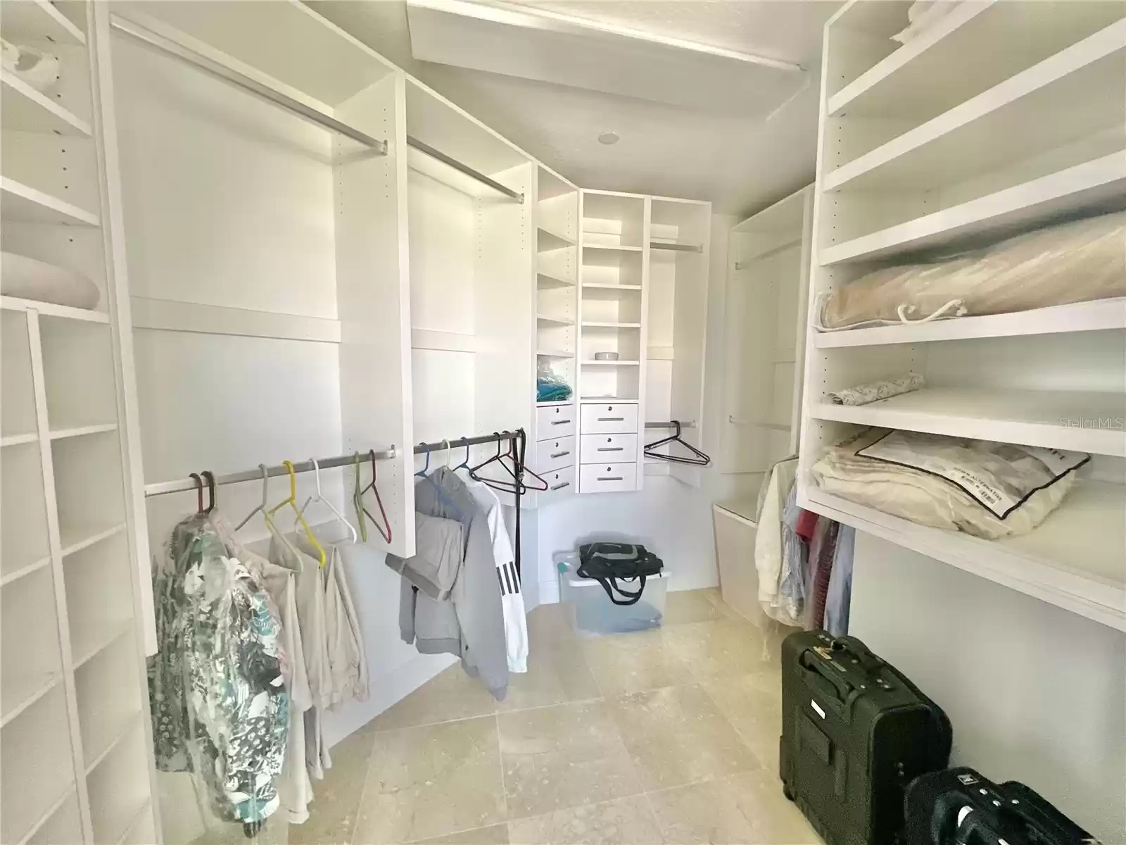 Large Walk-in Closet With Built-in Shelving