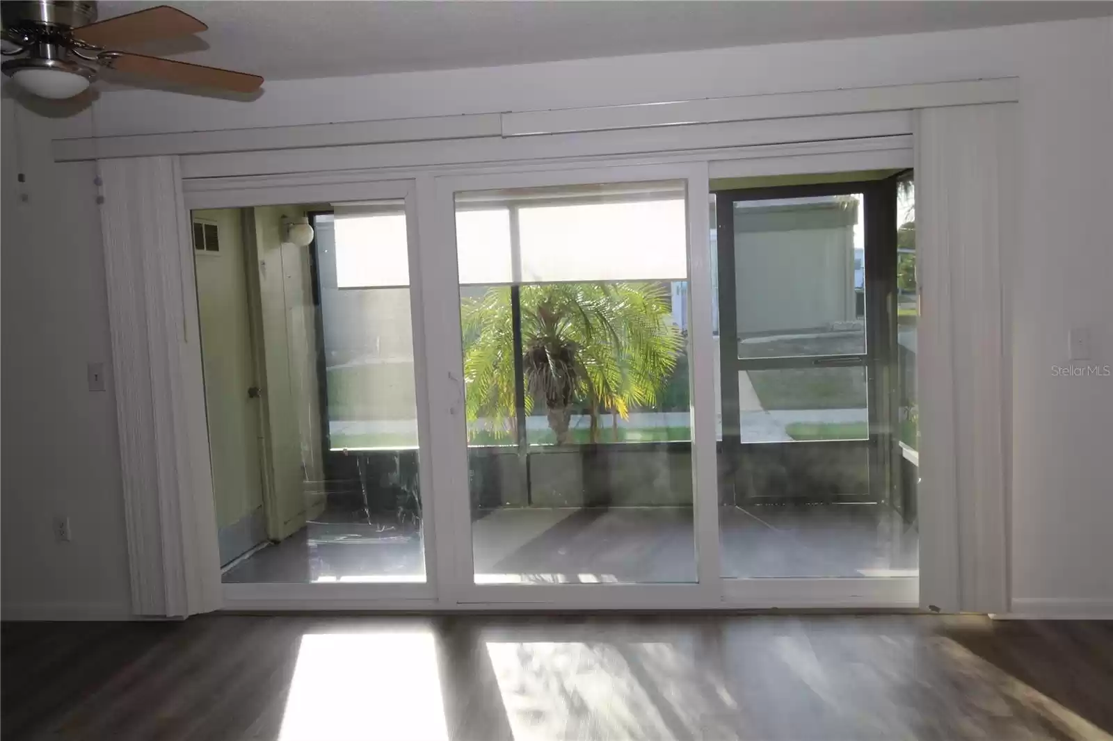 Living area, view of front porch and courtyard