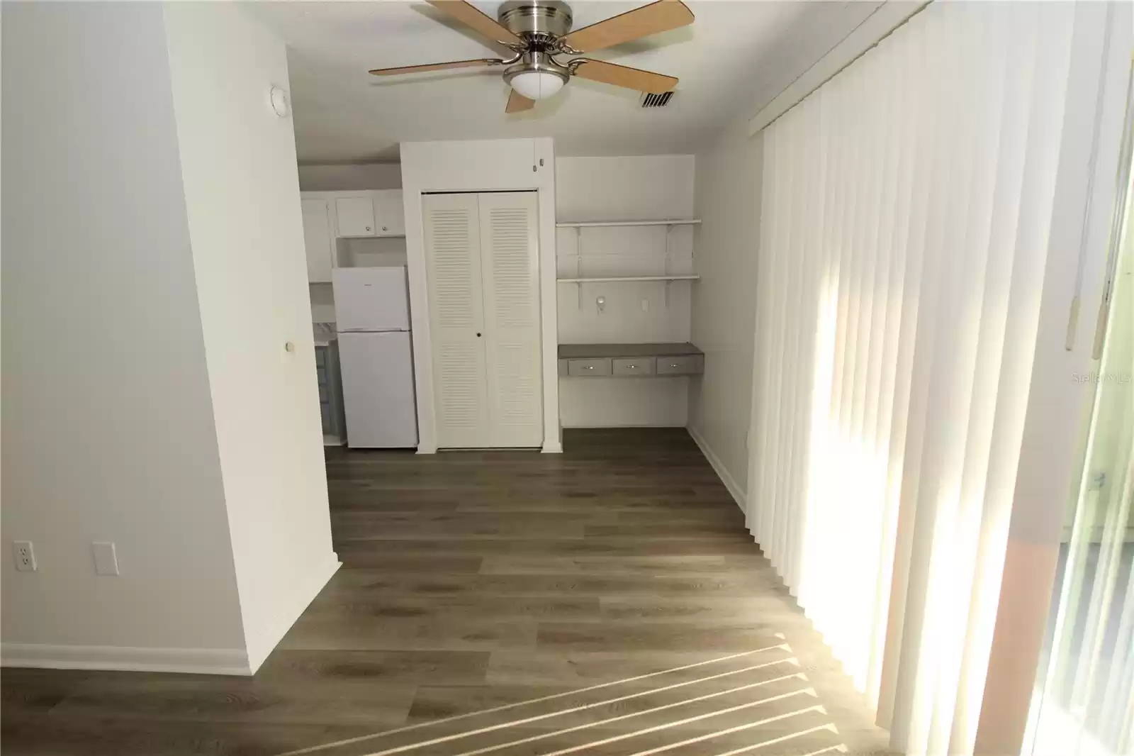 Dining area with server and display shelves