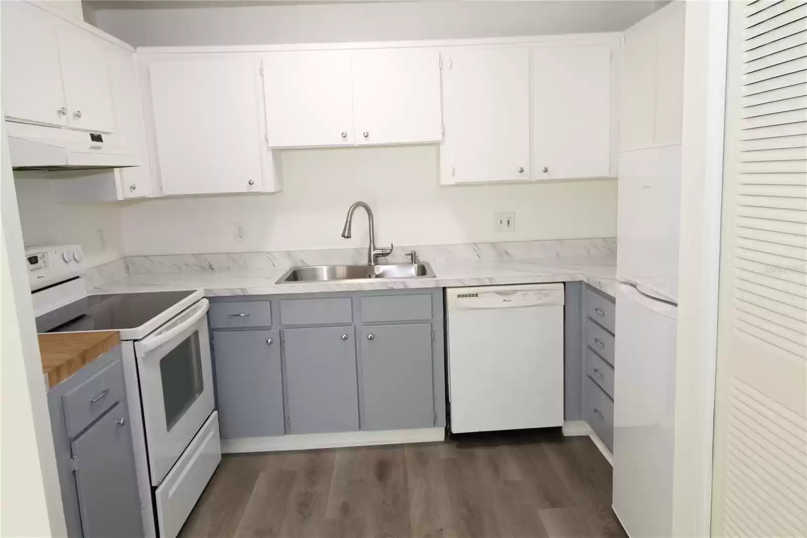 Kitchen, opens to the dining area.