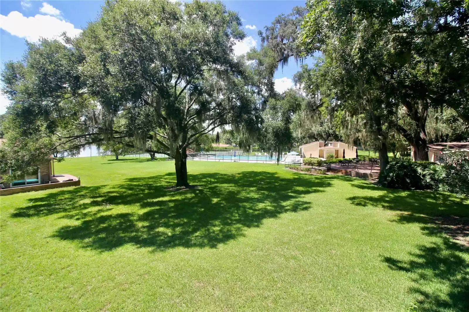 VIEW OF THE LAKE, POOL AND CLUBHOUSE