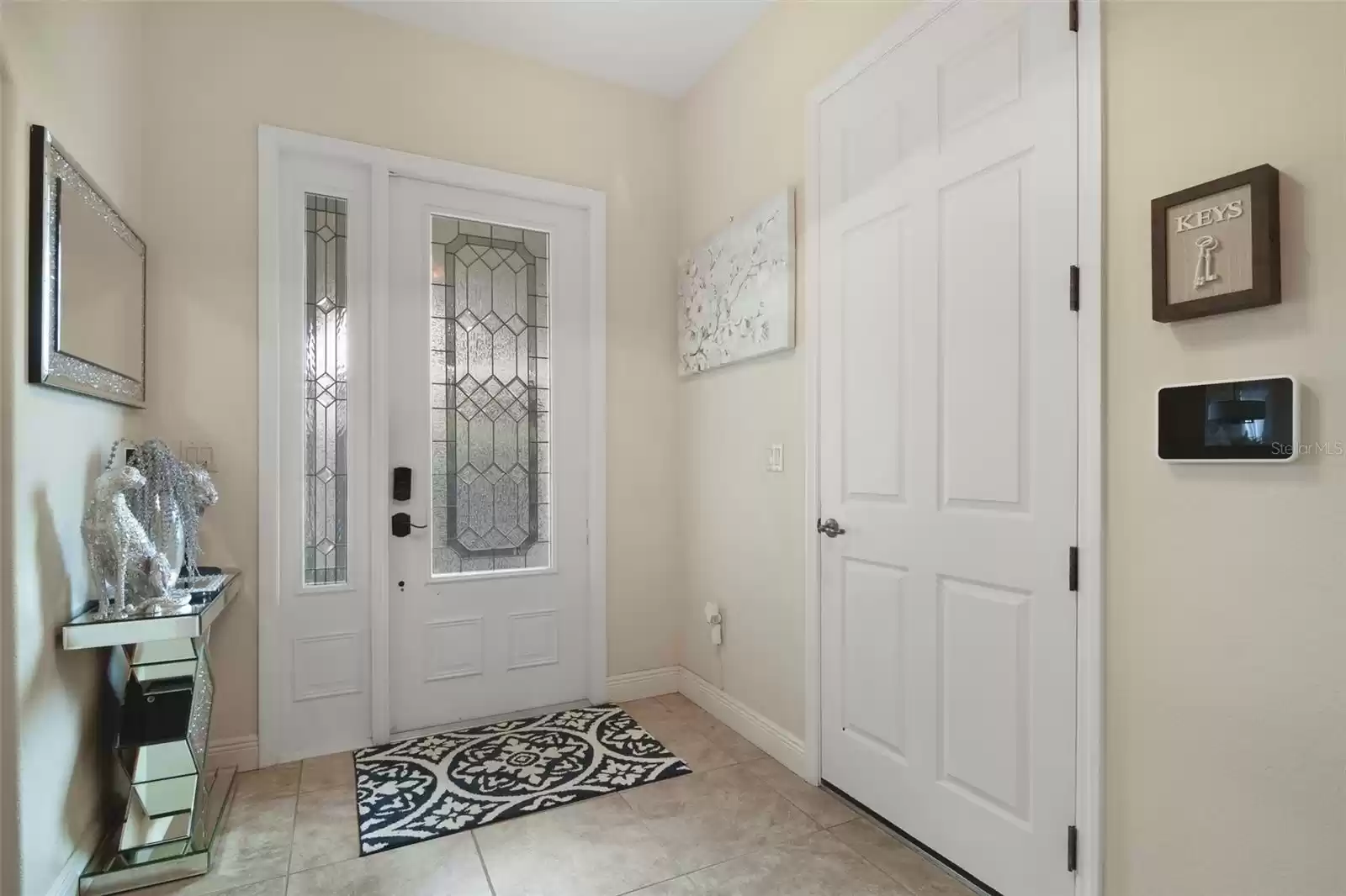 Front door entryway and door to garage