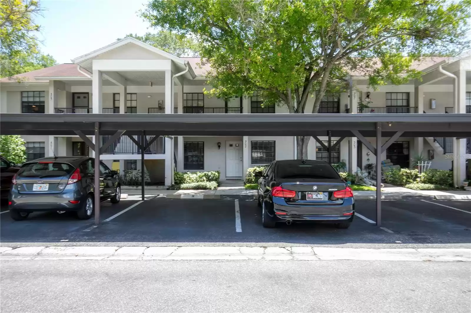 Private carport right in front of your unit door.