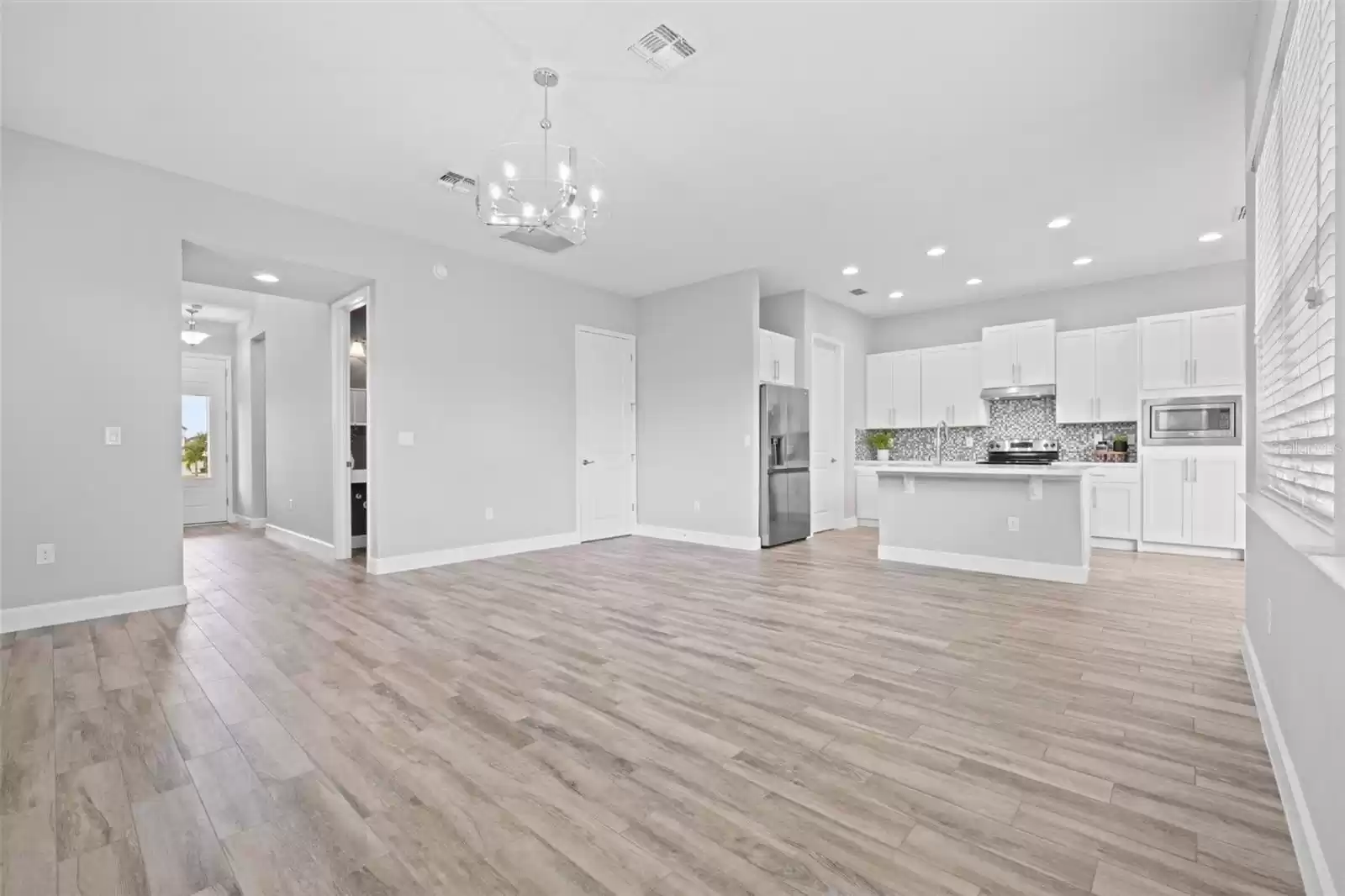 Open Concept Living Room, Kitchen and Dining. Natural Light.