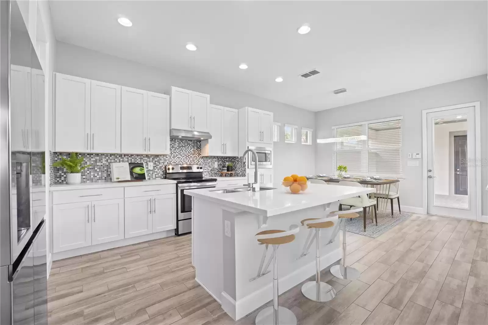 “Virtually Staged” Open Concept Kitchen and Dining.