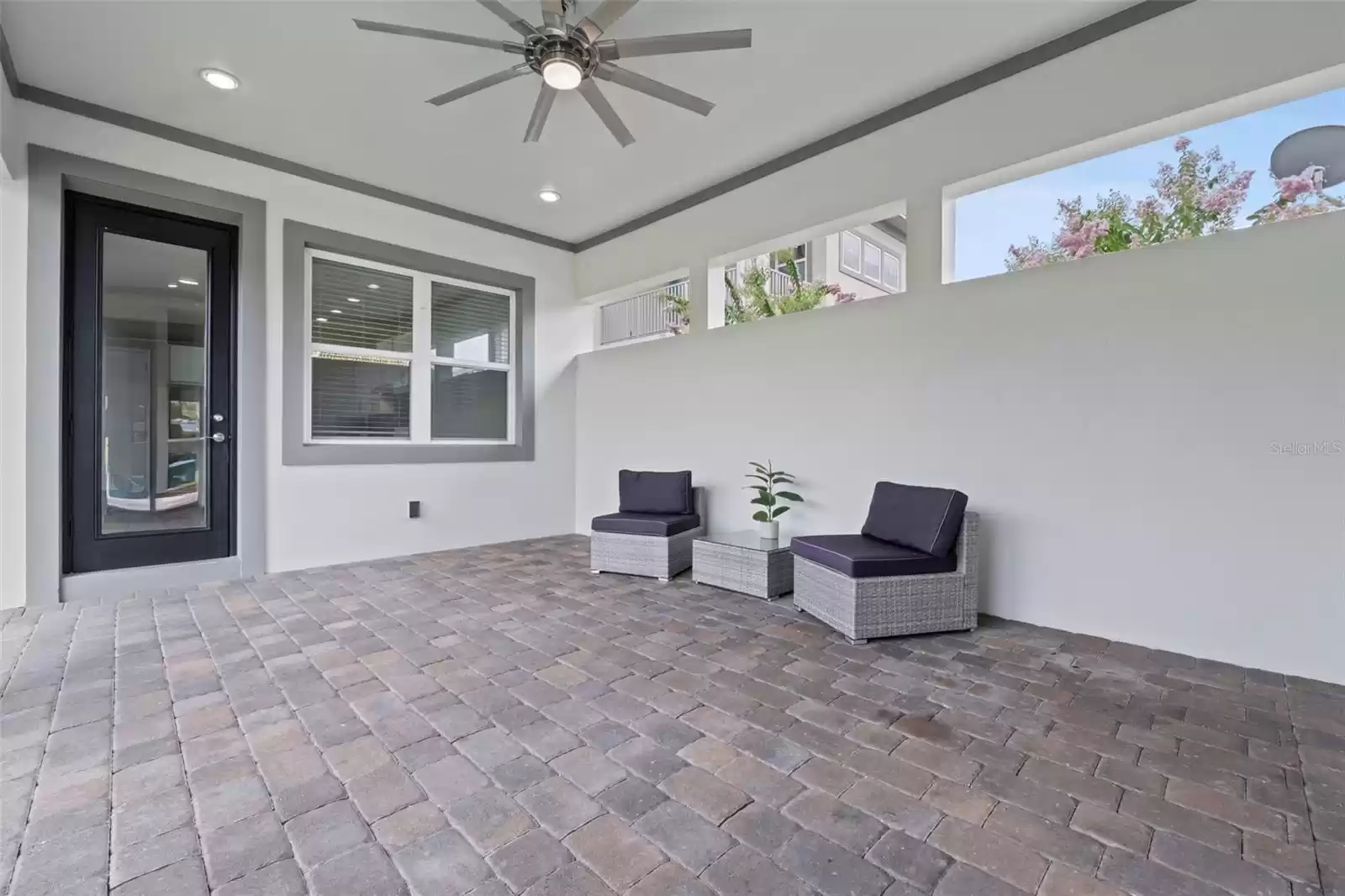 Covered Pavered Lanai with Fan.