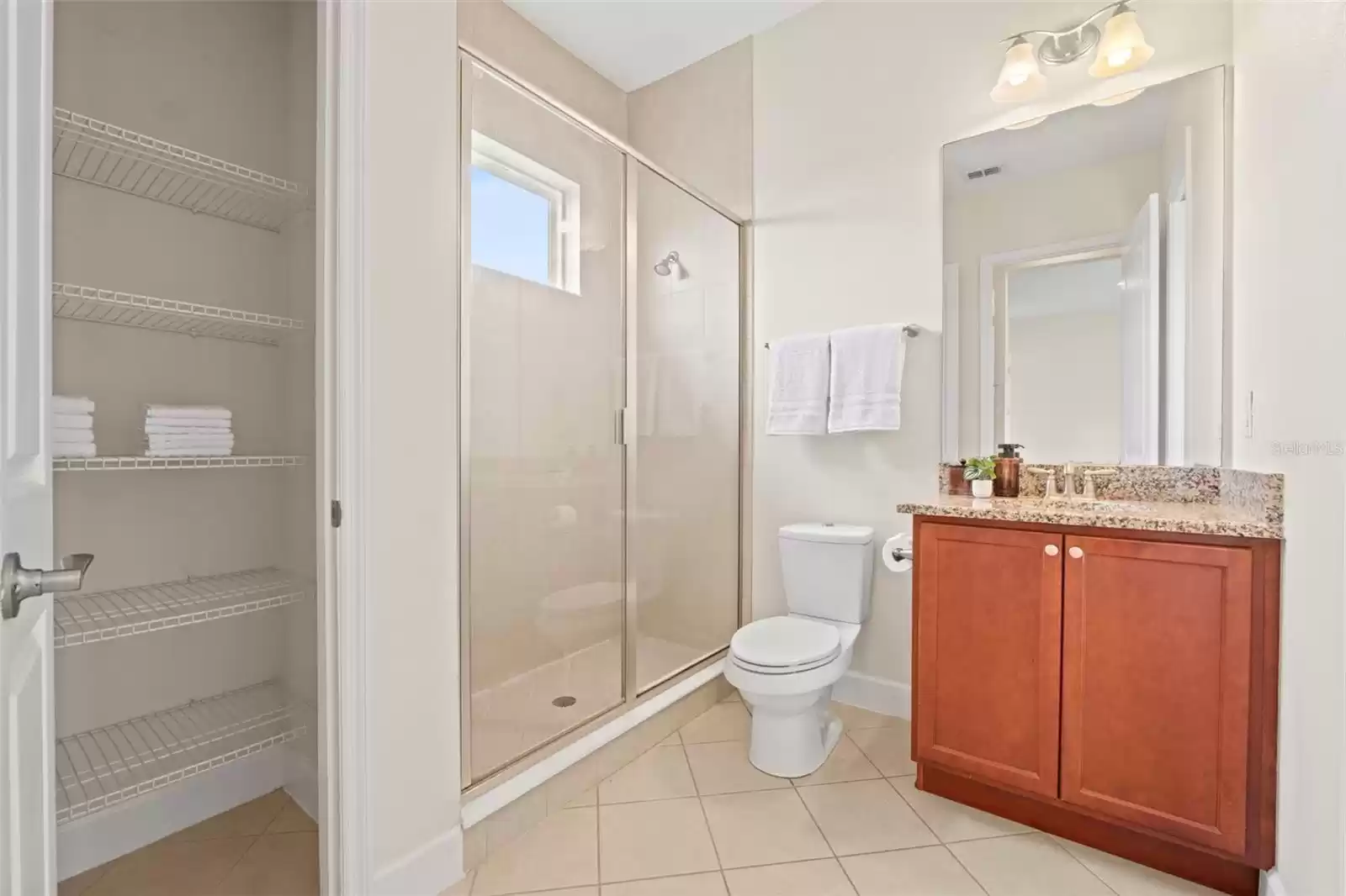 Above Garage Apartment Bathroom with Linen Closet.