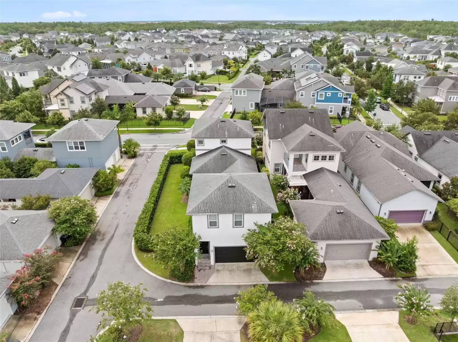 Aerial Shot Single Family Home with Detached Garage and Above Garage Apartment (ADU).