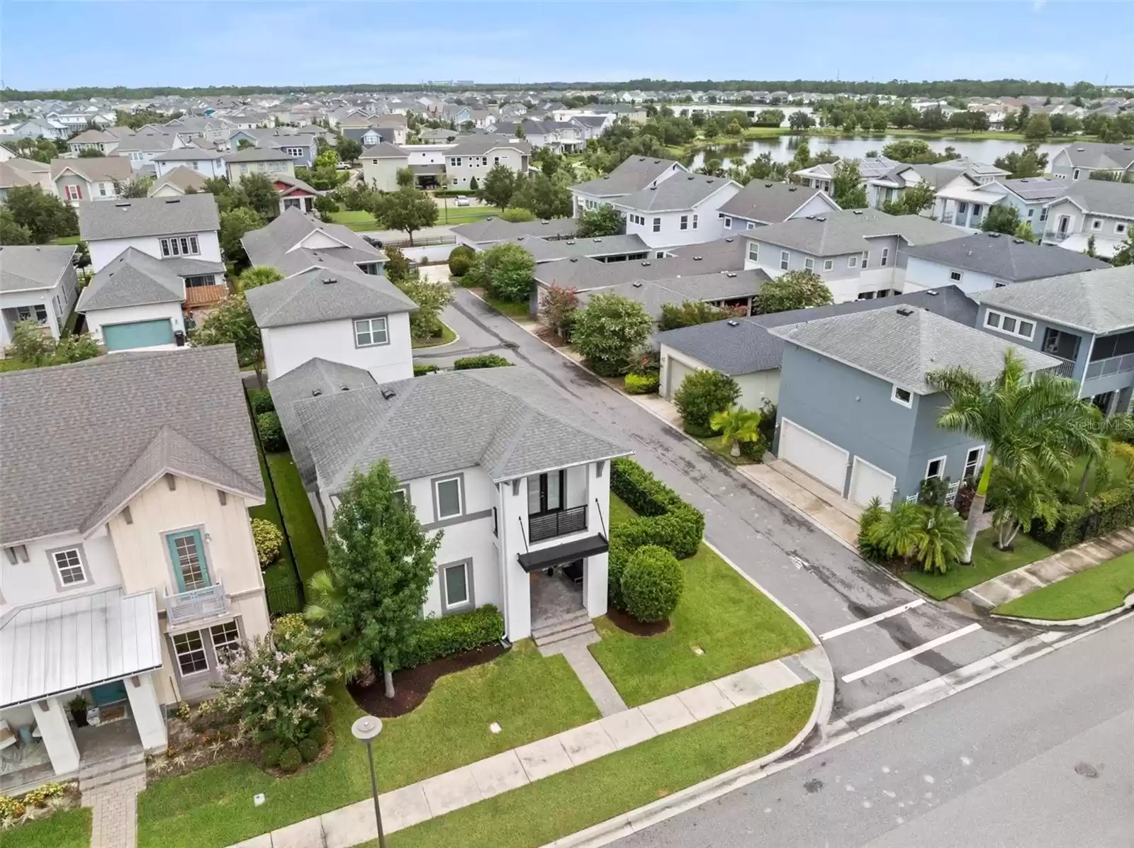 Aerial Shot Single Family Home with Detached Garage and Above Garage Apartment (ADU).