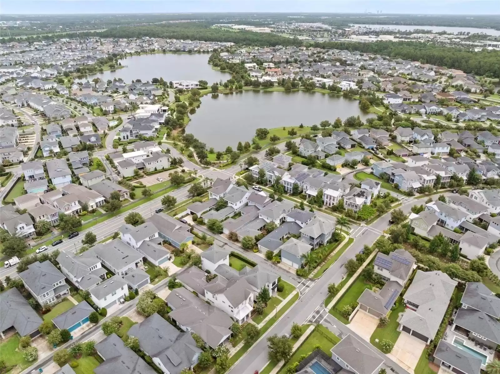 Aerial Shot Single Family Home with Detached Garage and Above Garage Apartment (ADU).