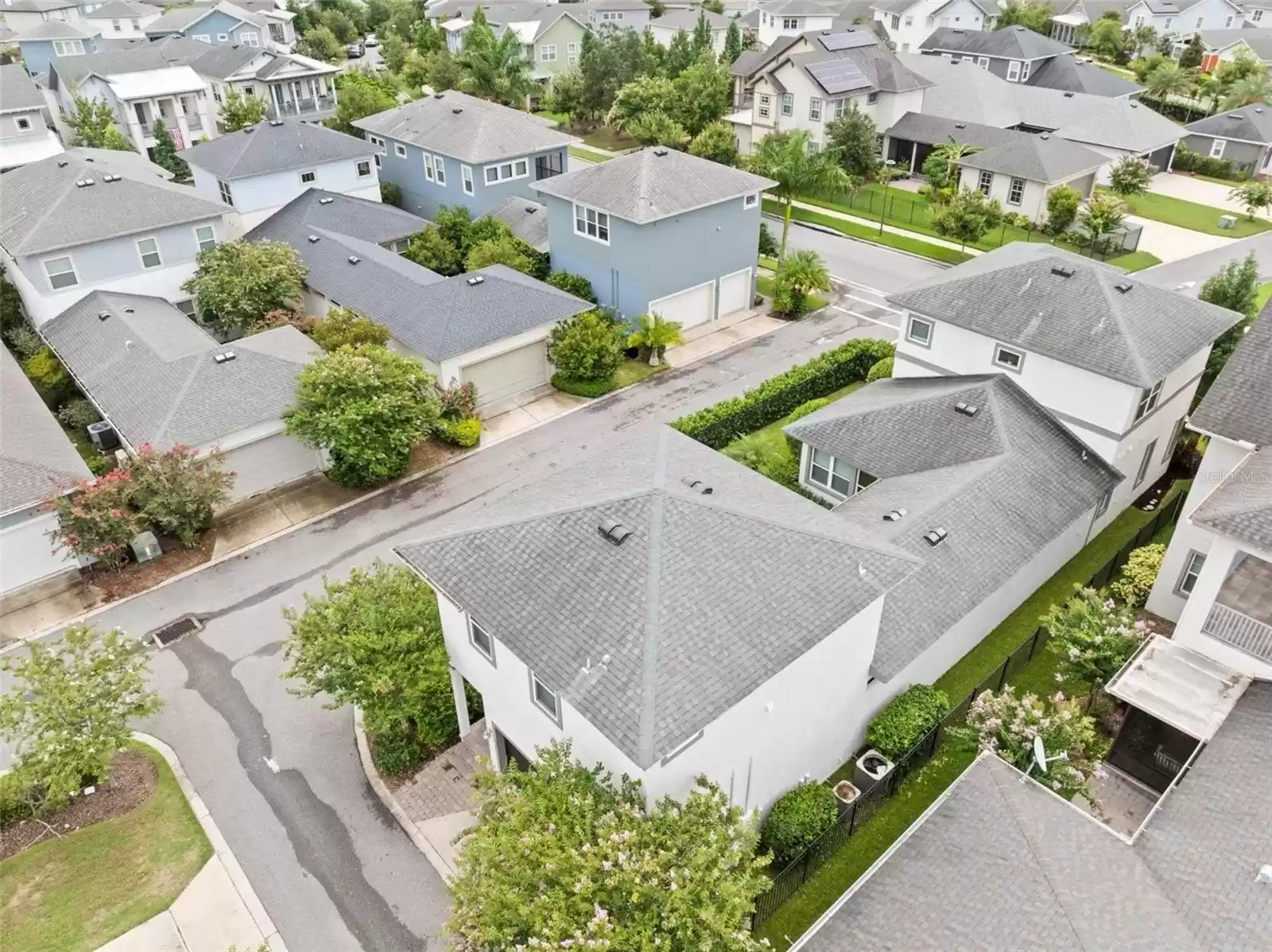 Aerial Shot Single Family Home with Detached Garage and Above Garage Apartment (ADU).