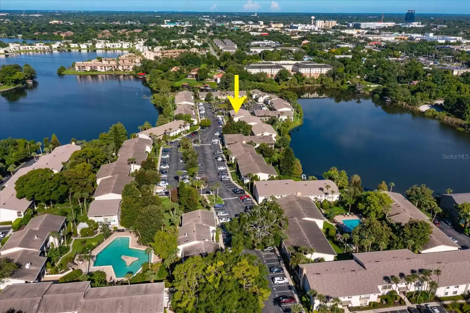 view from above of condo location and 2 pools are visible