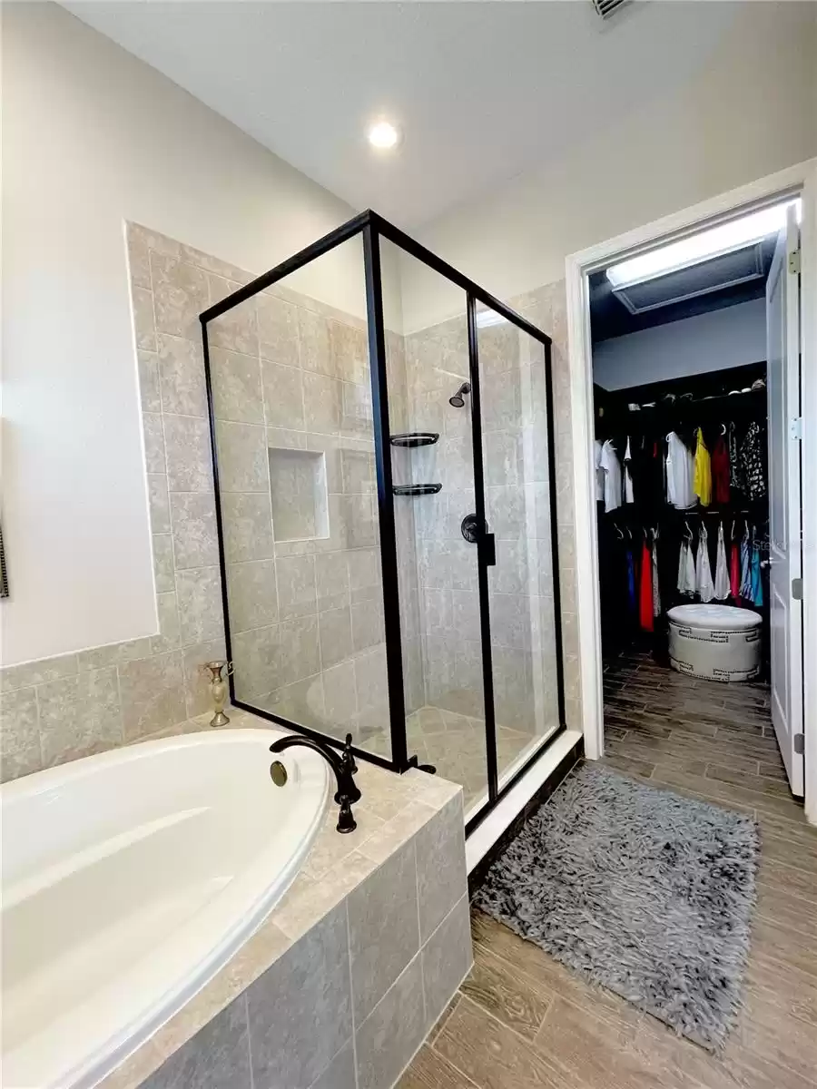 Master bath leading to custom closet