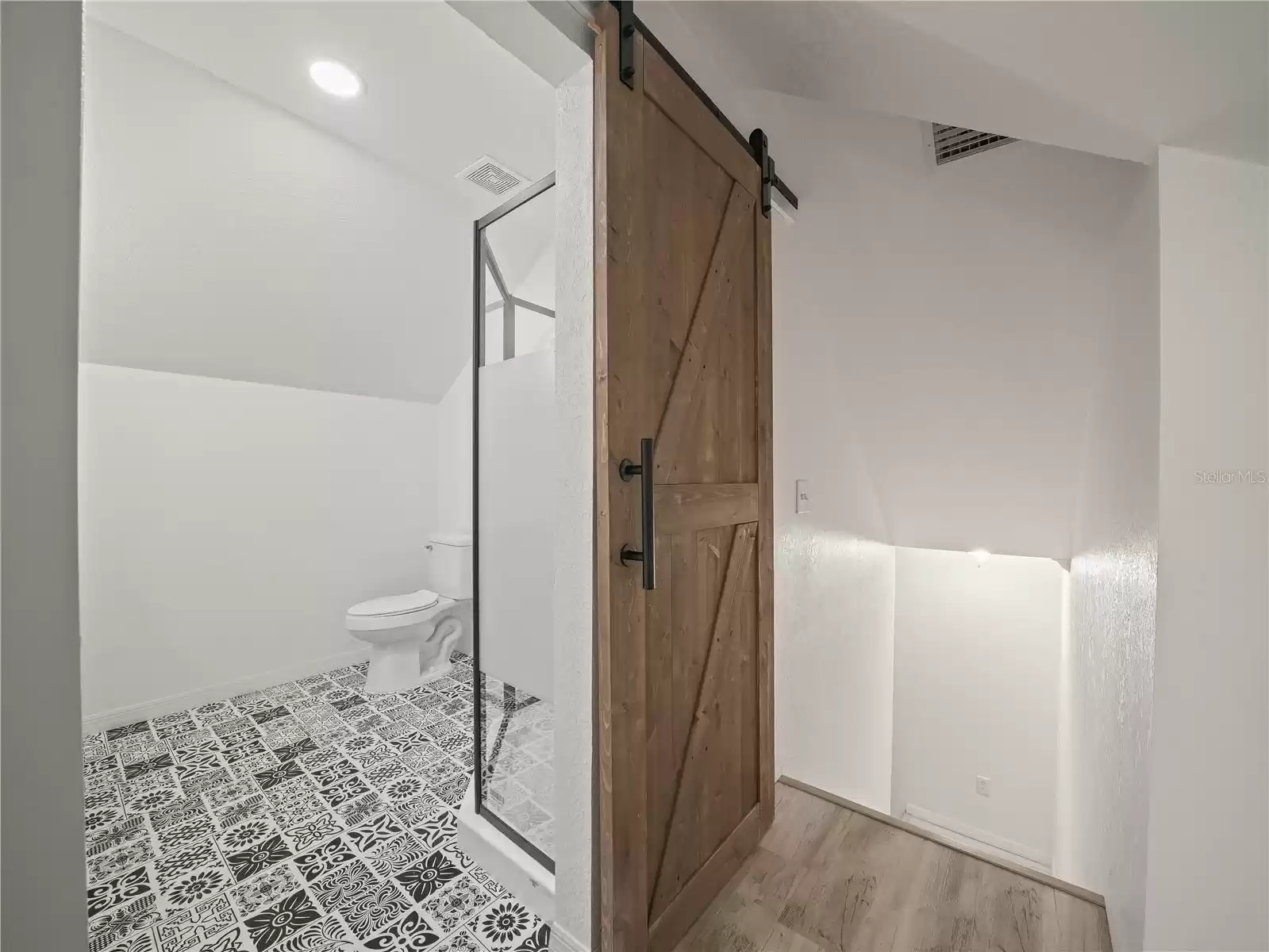 Barn door upstairs bathroom