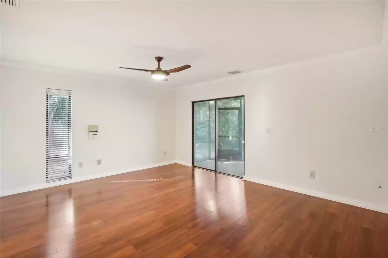 Master bedroom with sliders to back porch