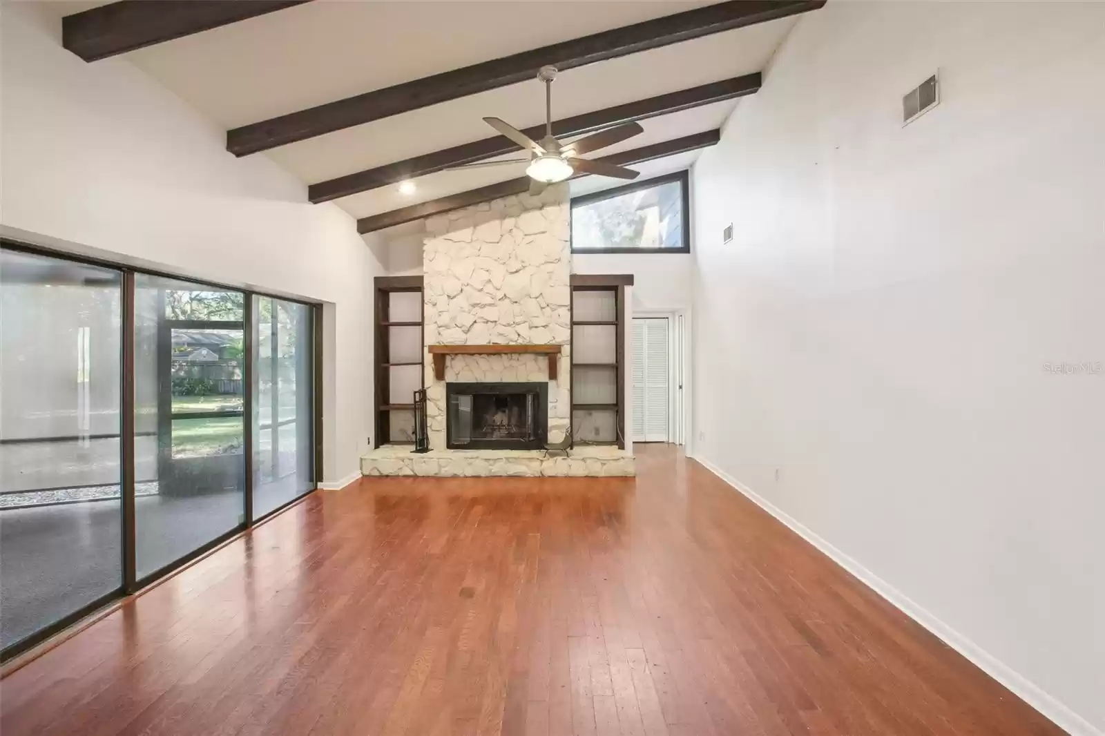 Large family room with hall to back bathroom and bedroom #3