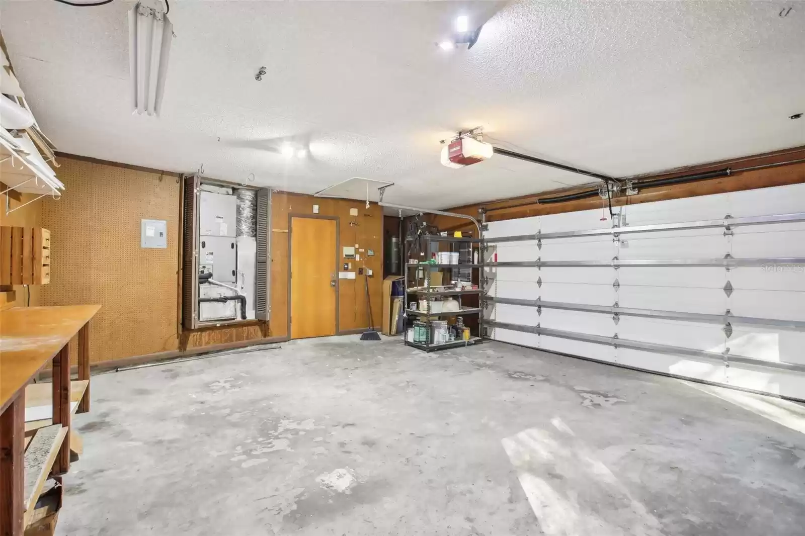 Garage with built in shelves, electrical and AC