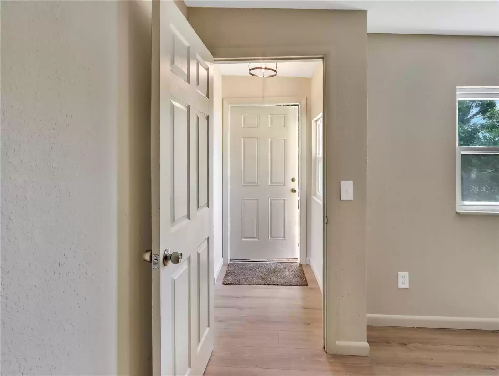 Hallway to 3rd Bedroom & Back Door