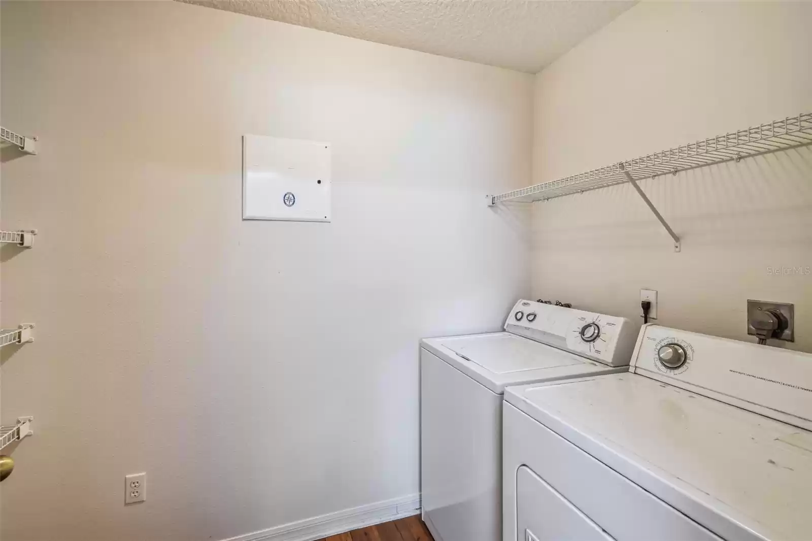 Laundry room is next to kitchen with plenty of space to use for pantry area