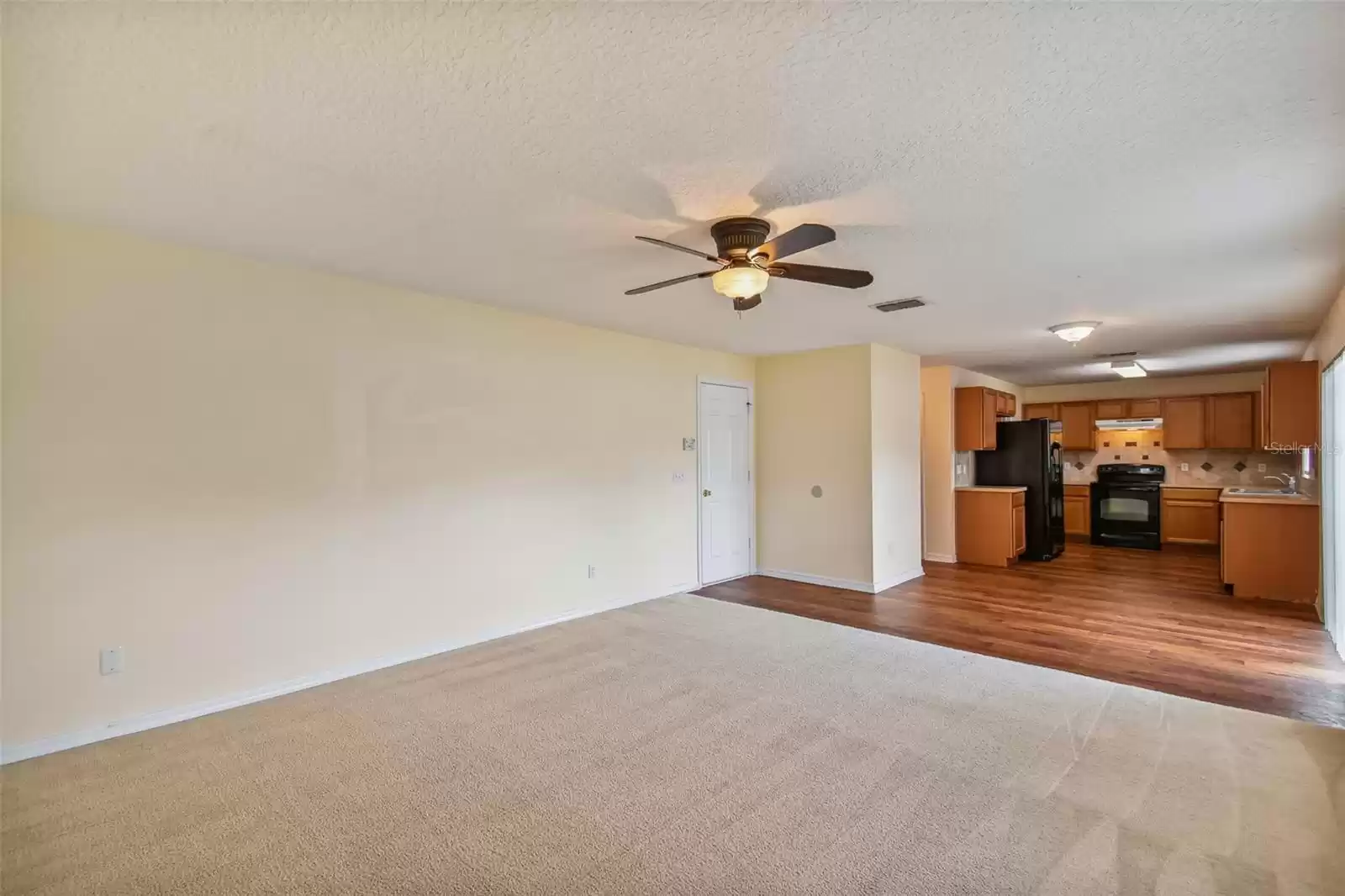 View from family room into dining and kitchen