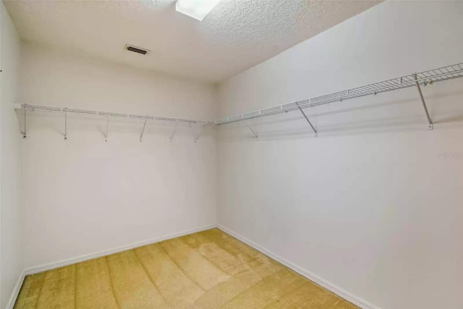 Huge walk-in closet in the primary suite is almost the size of another room