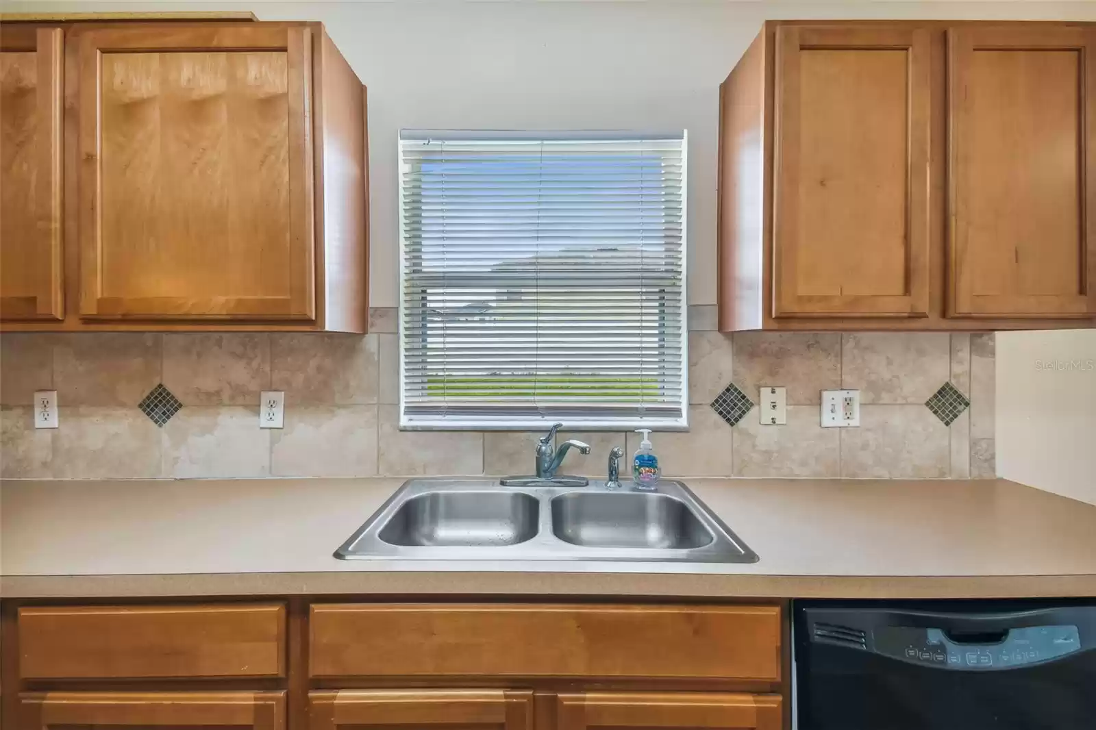 Kitchen window overlooking the backyard