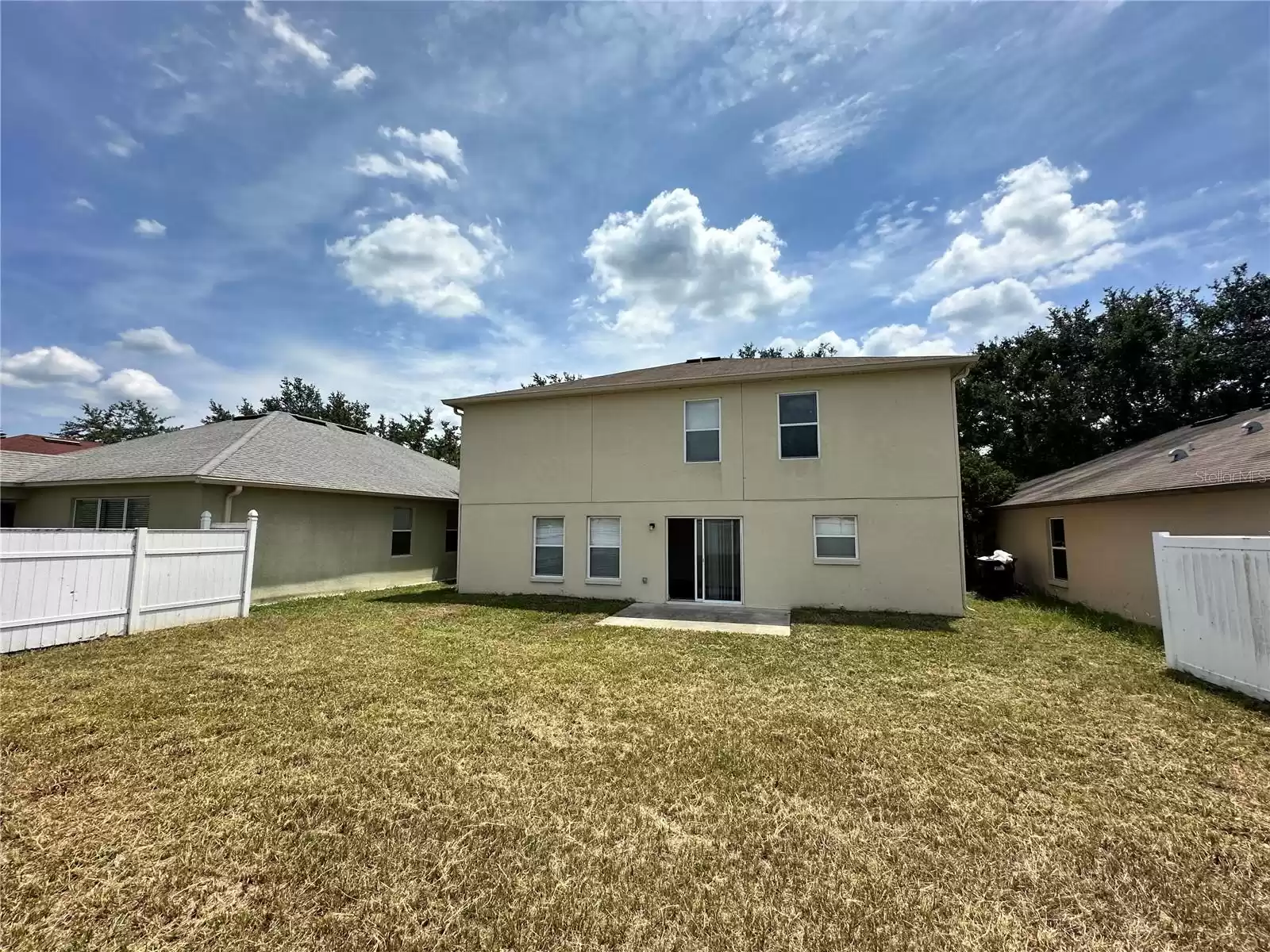 Large backyard is fenced on 3 sides.