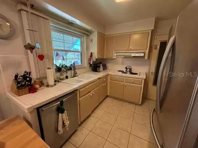 Lots of cabinets. Newer refrigerator.