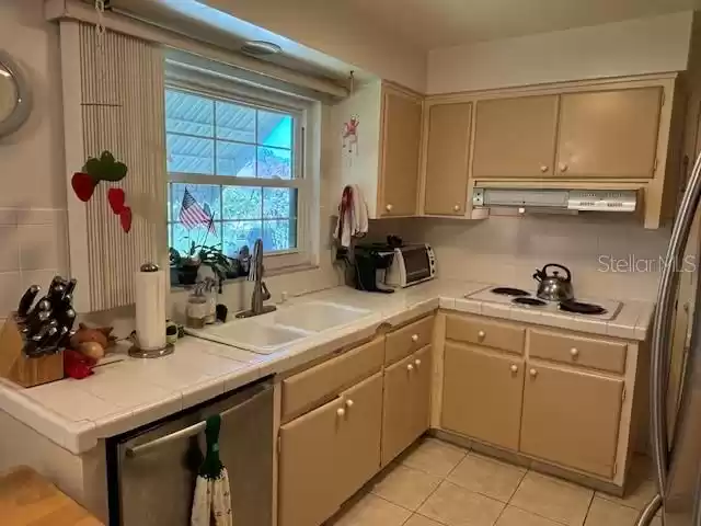 Impact Resistant Windows. Stove Top cooking area.