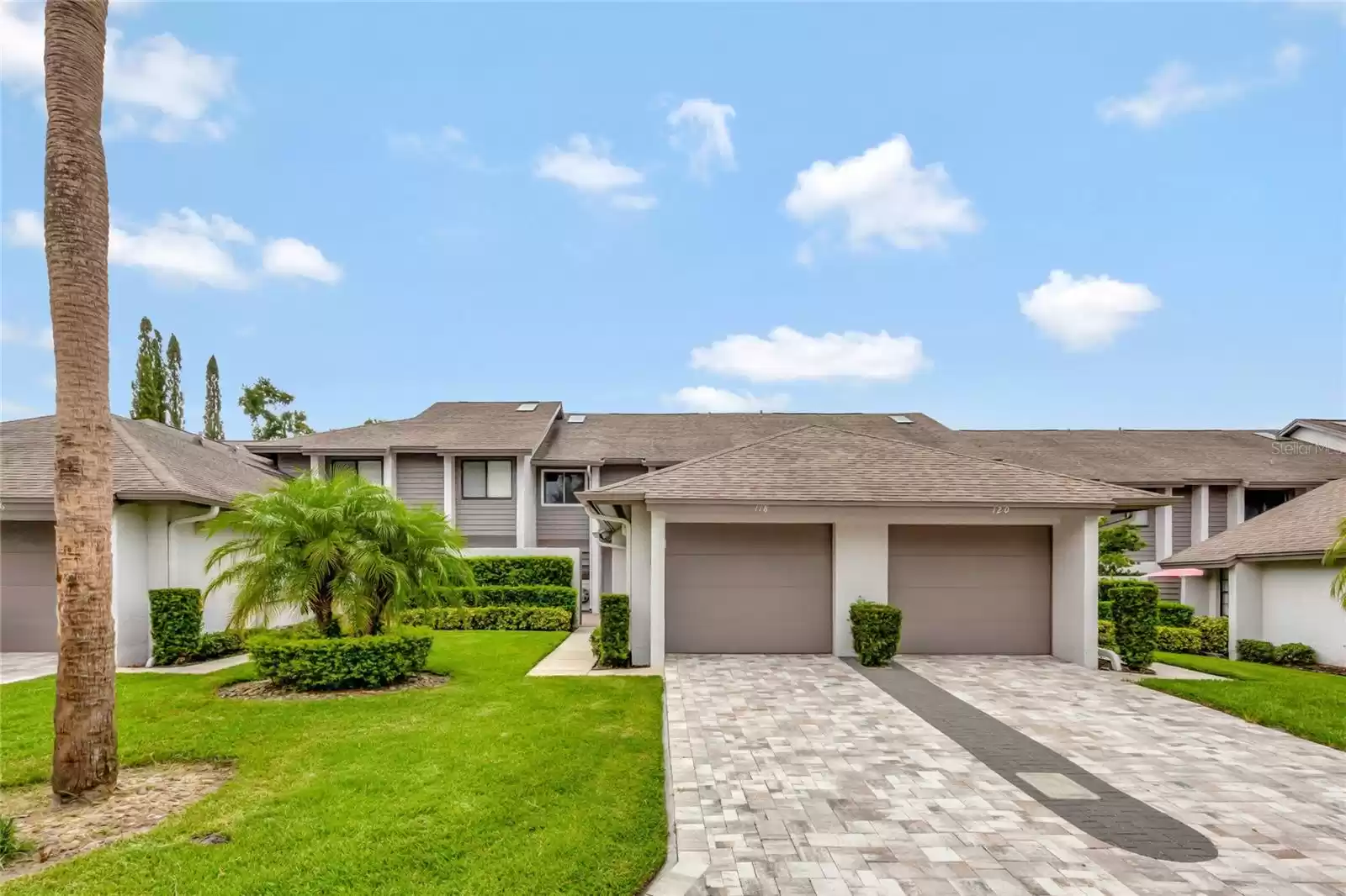 Private garage with pavered driveway