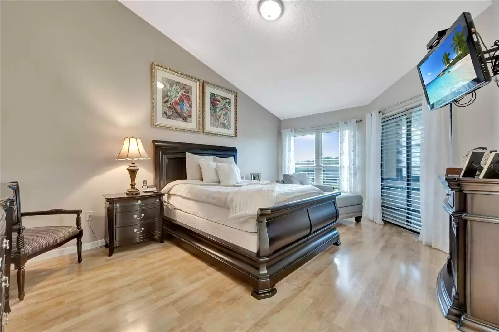 Primary bedroom with vaulted ceilings