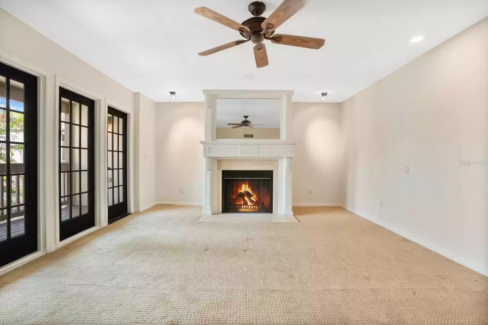 Expansive upstairs primary bedroom festuring wood burning fireplace